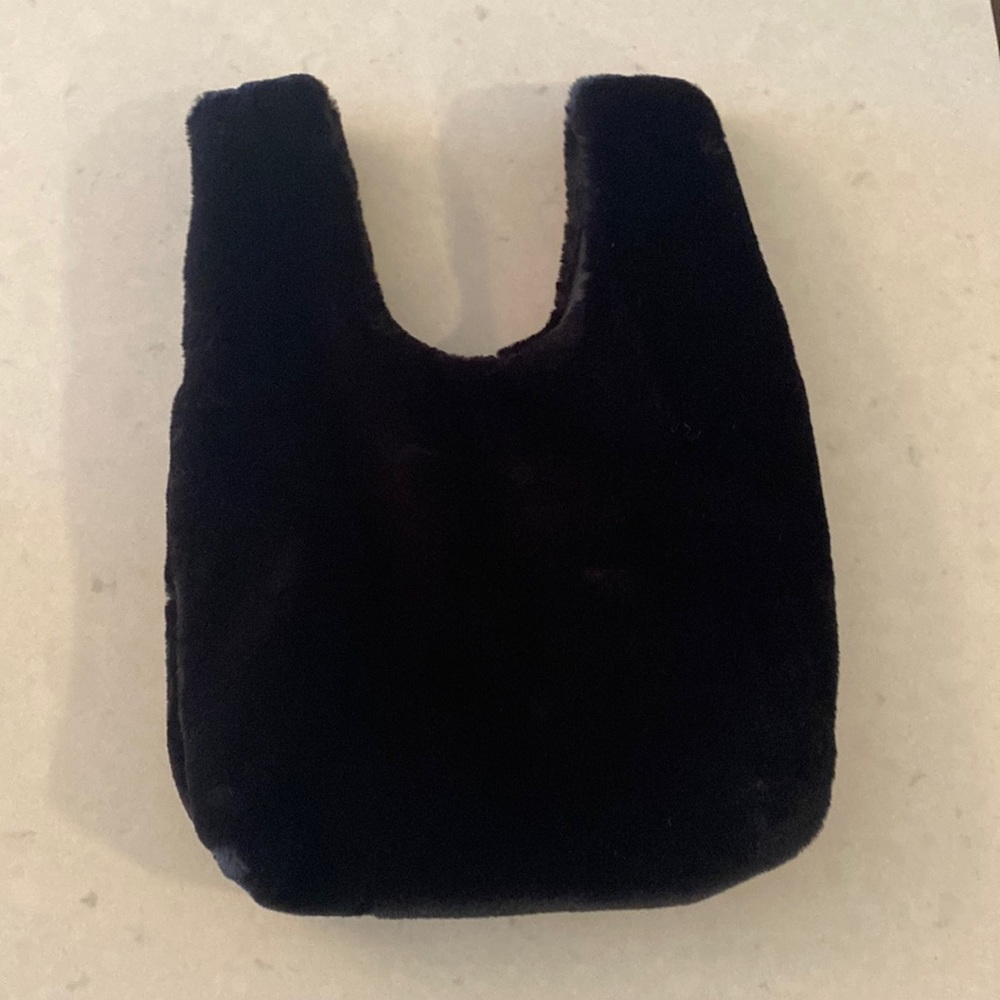 Faux fur black wristlet styled in multiple ways.